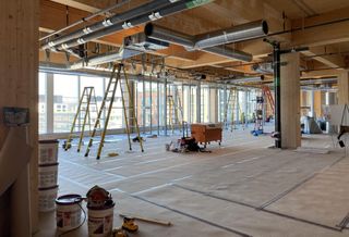 Contractors are completing tenant space in the addition to 80 M St. SE, one of D.C.'s first mass timber buildings.