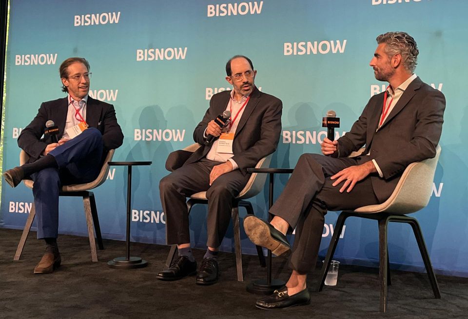Slate Property Group's David Schwartz, Rosenberg & Estis' Daniel Bernstein and NYC Housing Preservation & Development's Adam Phillips onstage at Bisnow's 2026 New York Affordable Housing Conference.
