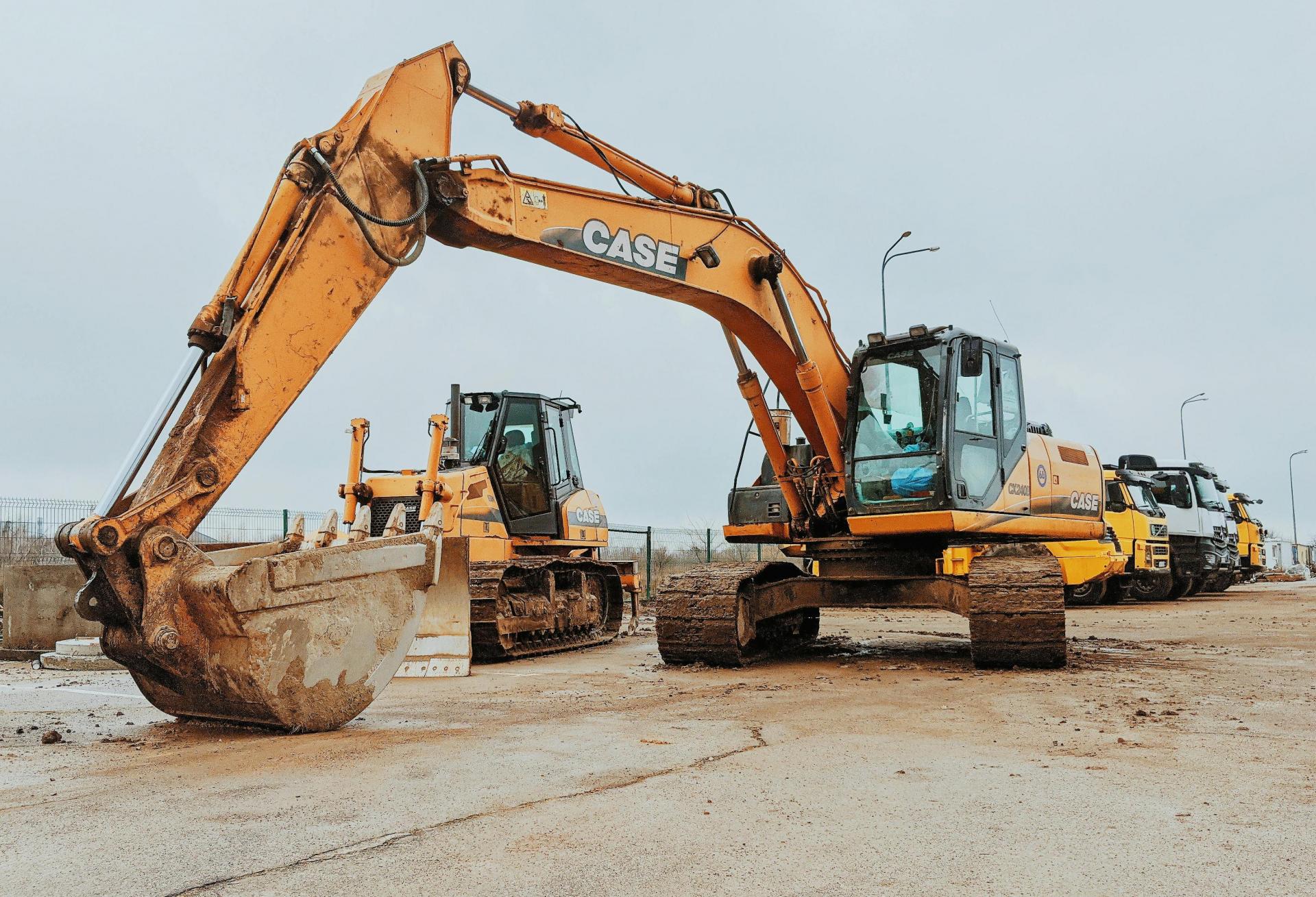 Several construction vehicles at a site