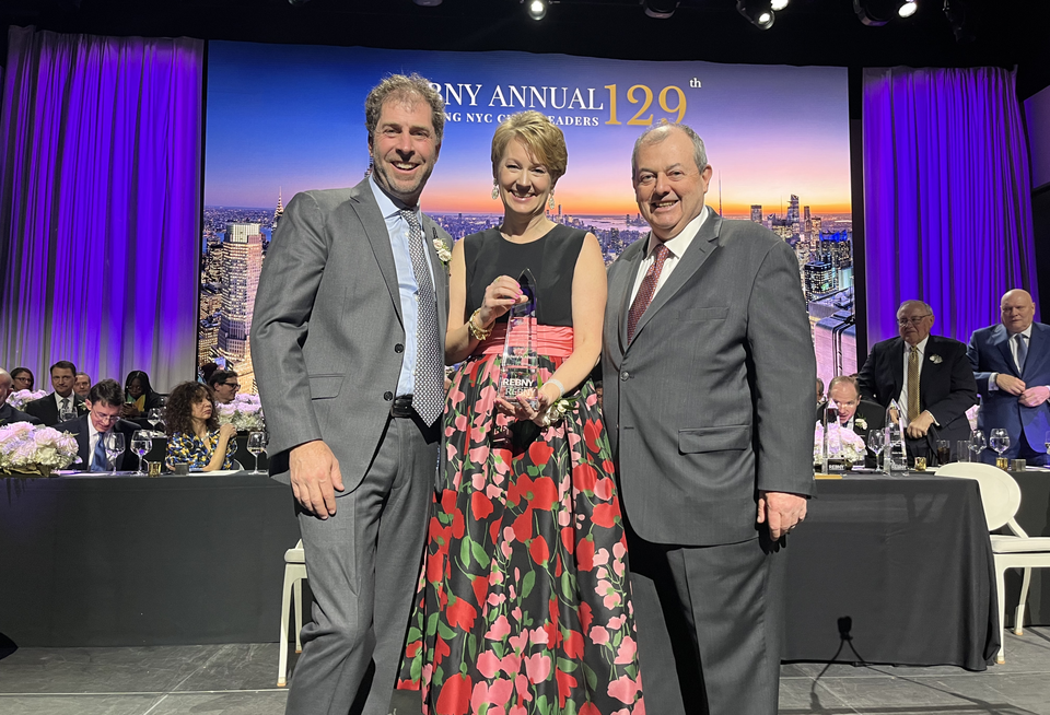Tishman Speyer's Michelle Adams being presented with REBNY's Kenneth R. Gerrety Humanitarian Award by Two Trees' Jed Walentas and REBNY President Jim Whelan.