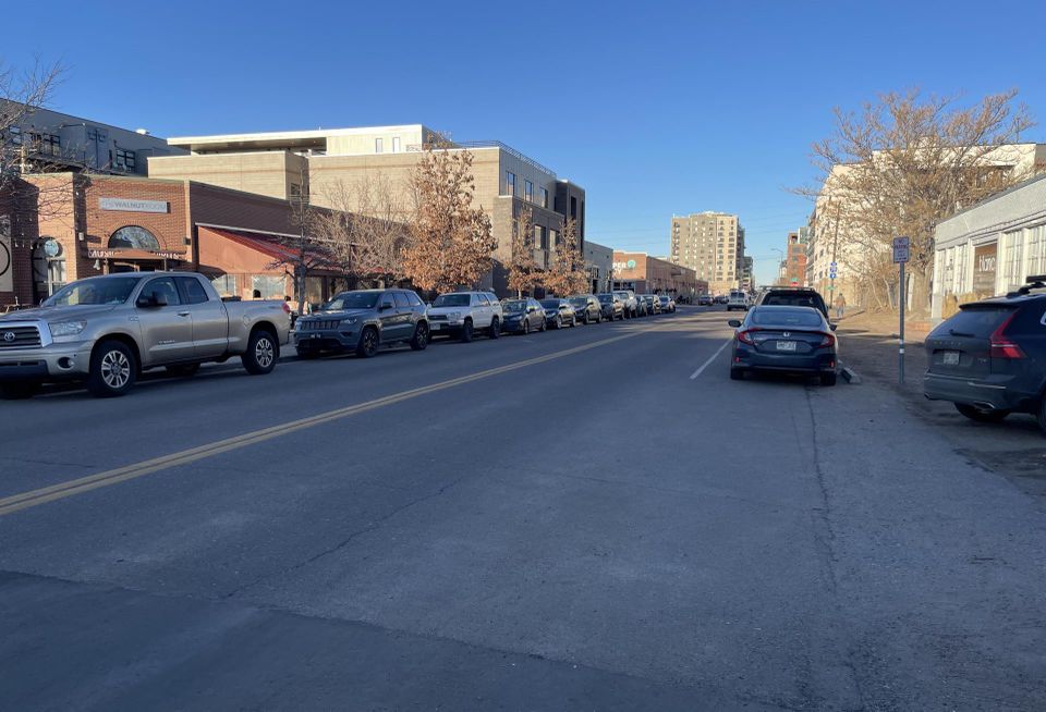 A view of The Walnut Room in RiNo and the lack of sidewalks across the street.