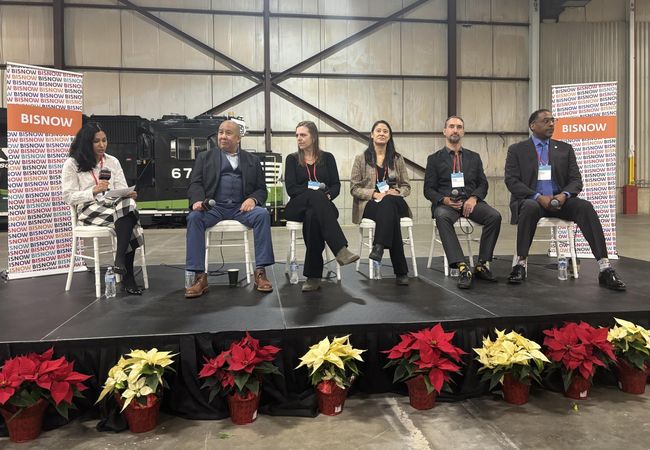 From left to right, sitting on a stage: Husch Blackwell's Nida Ghaffar, Commission on Chicago Landmarks' Ernest Wong, Knickpoint Ventures' Sheilah Carroll, City of Chicago's Cindy Chan Roubik, W.E. O’Neil Construction's Chad Huber and DL3 Realty's Leon Walker.