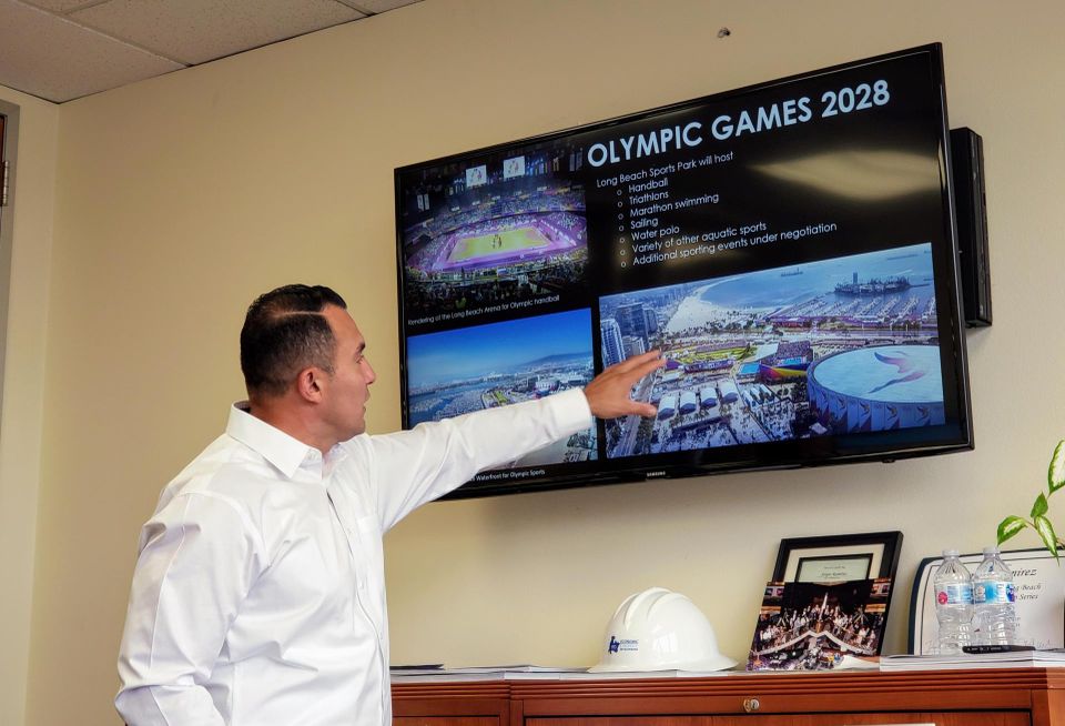 Long Beach Deputy Director of Economic Development Sergio Ramirez points at the city's preparation for the 2028 Summer Olympics in Los Angeles. Long Beach is hosting several sporting events for the olympics.