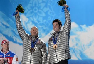 Steven Langton (right) and Steven Holcomb (left) displaying bronze medals in the 2014 Sochi Olympics. The two later had their medals upgraded to silver in 2019.