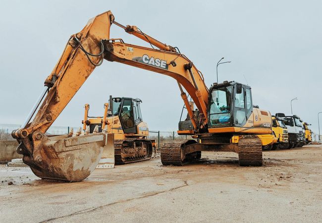 Several construction vehicles at a site