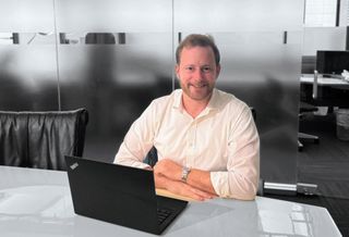 Chicago Atlantic's managing director and REIT co-resident Peter Sack at his desk.