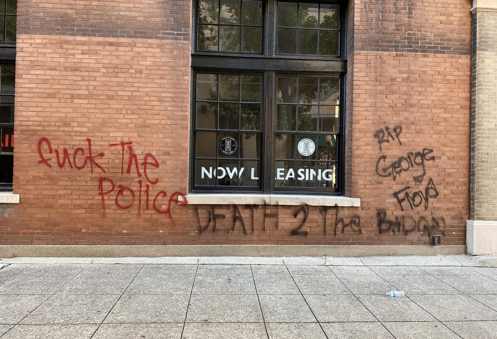 Spray paint covered walls of businesses all over Downtown Dallas after widespread protests Sunday, May 31, 2020.