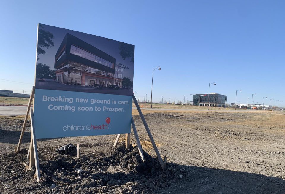 sign showing hospital groundbreaking