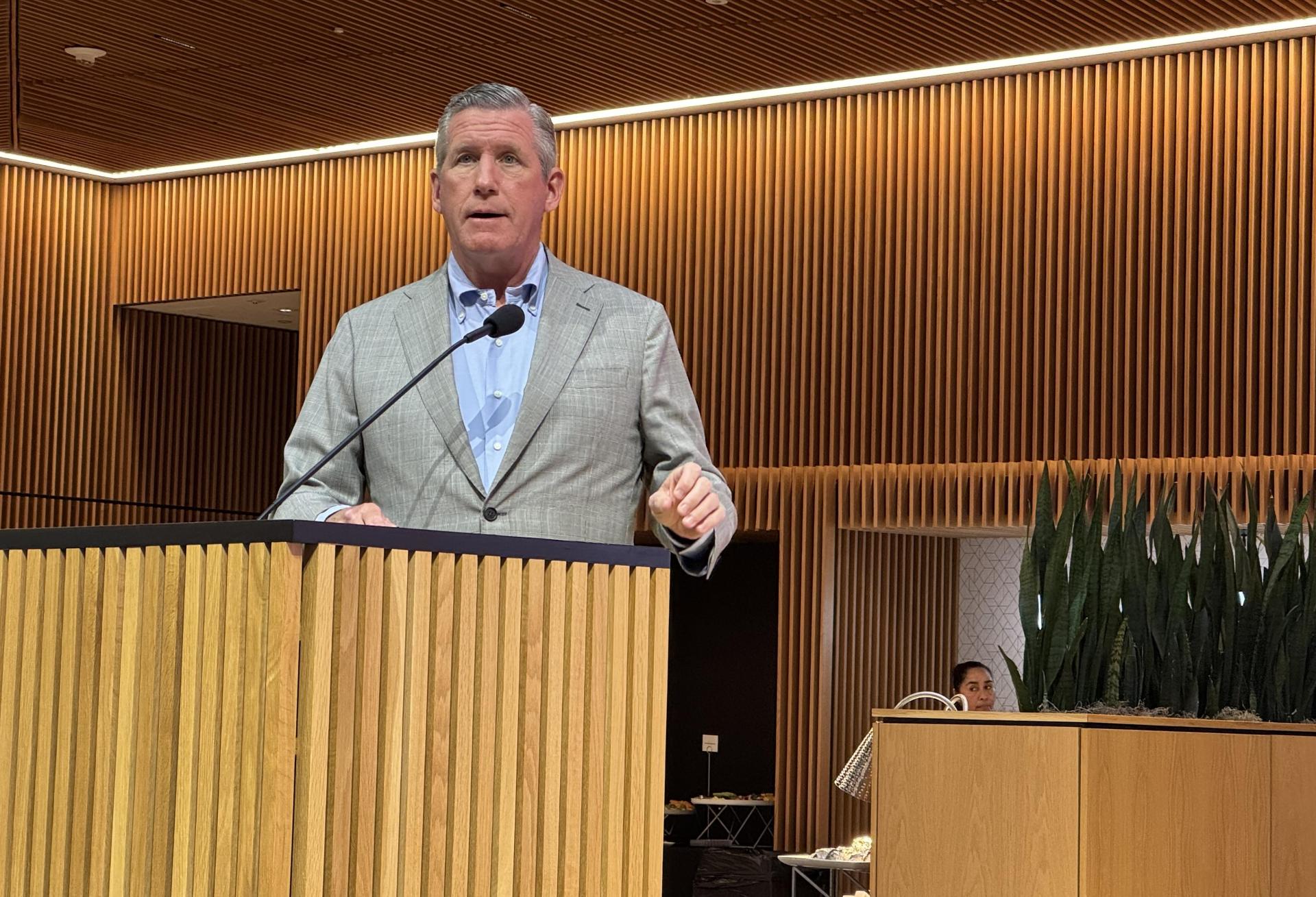 President & CEO of Texas Medical Center William F. McKeon speaking at a lectern. 