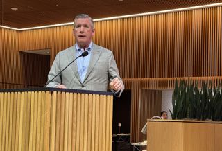 President & CEO of Texas Medical Center William F. McKeon speaking at a lectern. 
