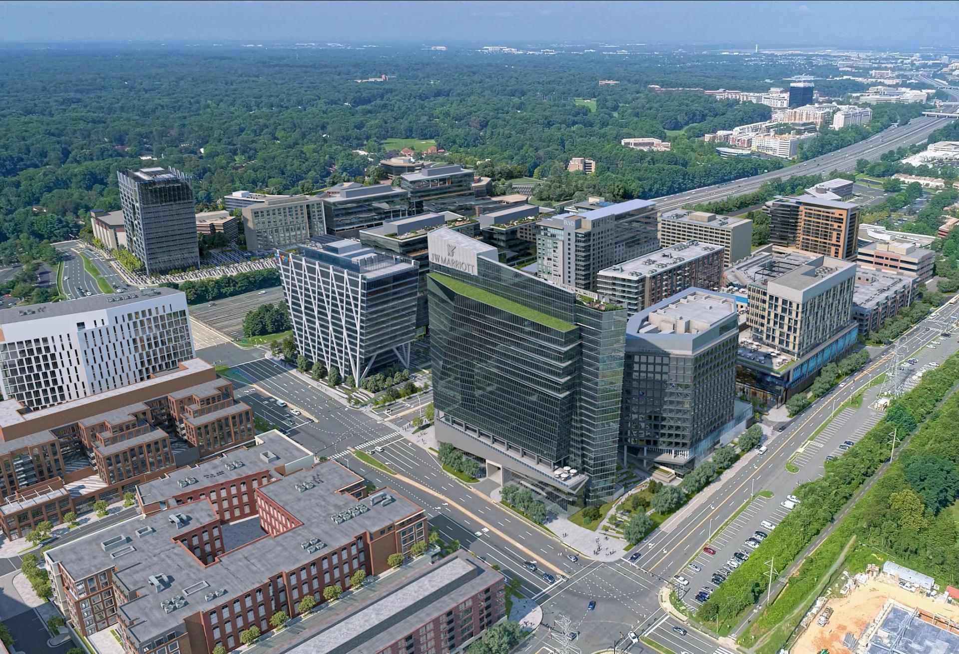 An overhead rendering of new development at Reston Station, with the under construction J.W. Marriott hotel in the foreground.