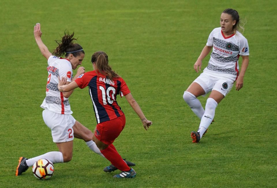 Three women play professional soccer for the National Women's Soccer League in a game of the Washington Spirit versus Portland Thorns.