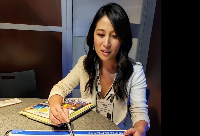 San Bernardino County Economic Development Coordinator Elisa Laurel points at a heat map of visitor traffic in San Bernardino.