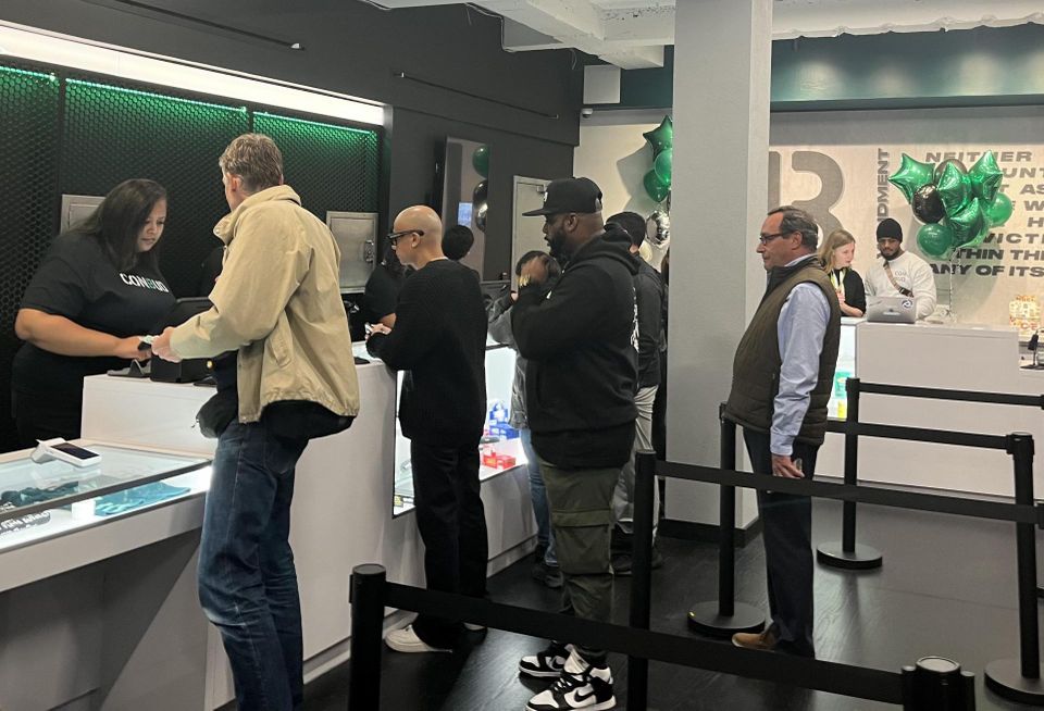 Customers inside dispensary Con Bud during its inaugural night of operation on Oct. 19, 2023.