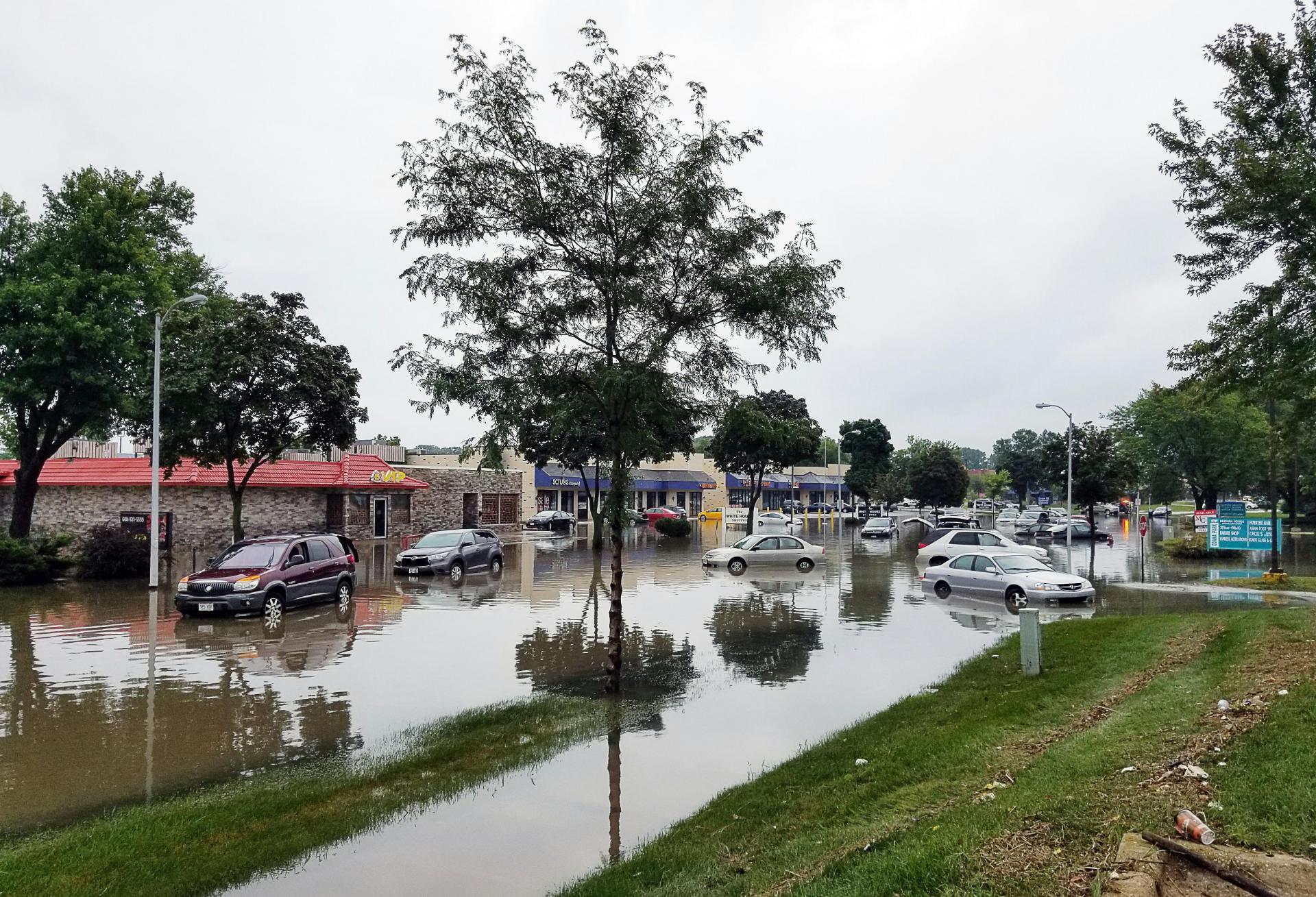 Flooding in Odanah, Wisconsin, in 2018 after heavy rains. Approximately 18.2M units of rental housing nationally are at risk from extreme weather events due to climate change, according to a new study from Harvard's Joint Center for Housing Studies.