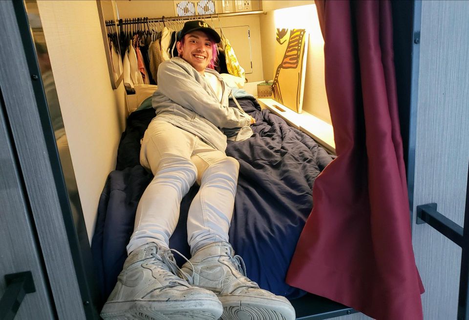 Singer/songwriter Jords Day lays down on a bed pod in Upstart's co-living building Hobart House in Los Angeles.