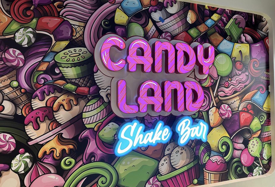 A sign for the Candy Land Shake Bar