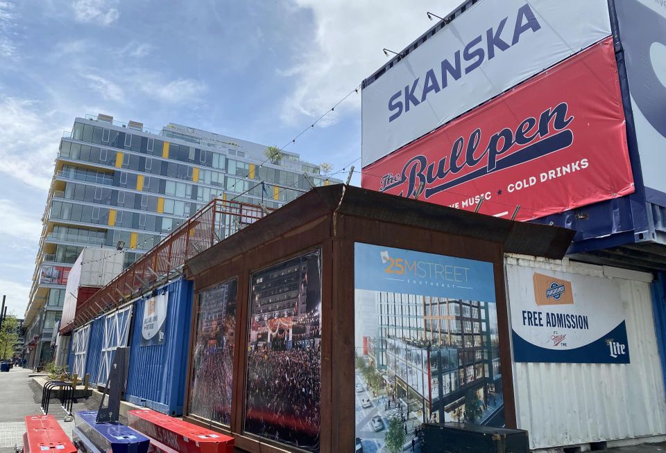 Exterior of The Bullpen with Skanska billboard in view