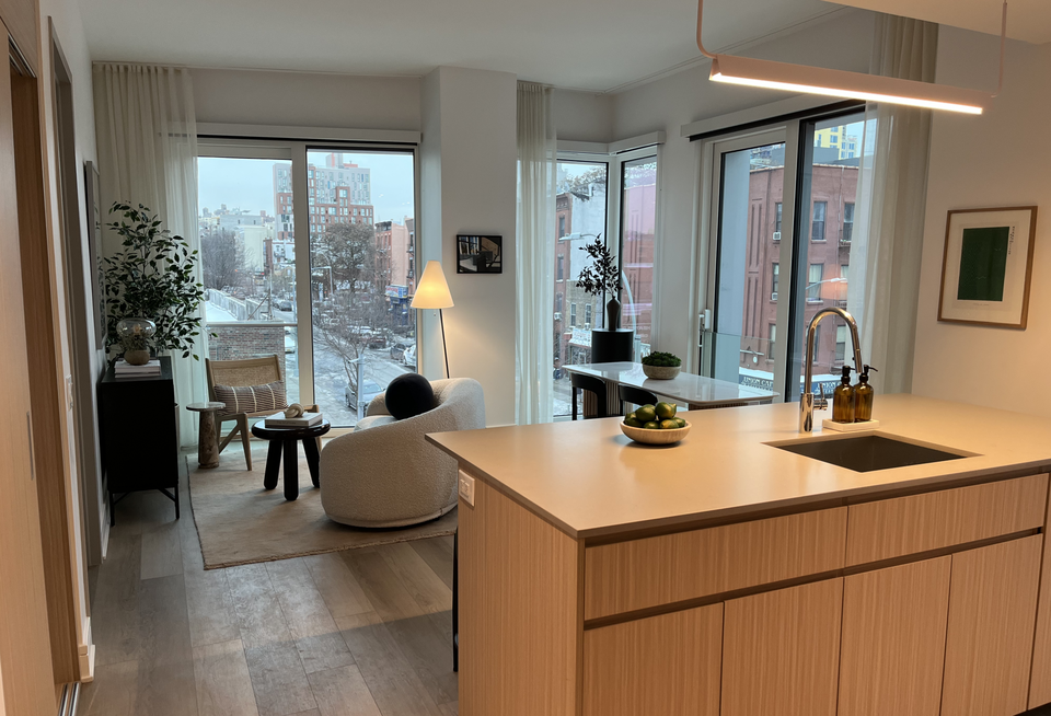 The kitchen and living room inside one of the apartments at Union Channel.