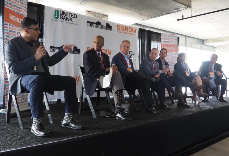 EYA's Aakash Thakkar, Montgomery Housing Partnership's Artie Harris, Bernstein Cos.' Marc Duber, Transwestern's Phil McCarthy, Chevy Chase Land Company's John Ziegenhein and Lerch, Montgomery County Planning Department's Carrie Sanders and Early & Brewer's Steve Robins speak on a panel during Bisnow's Future of Montgomery County event on May 17, 2022.