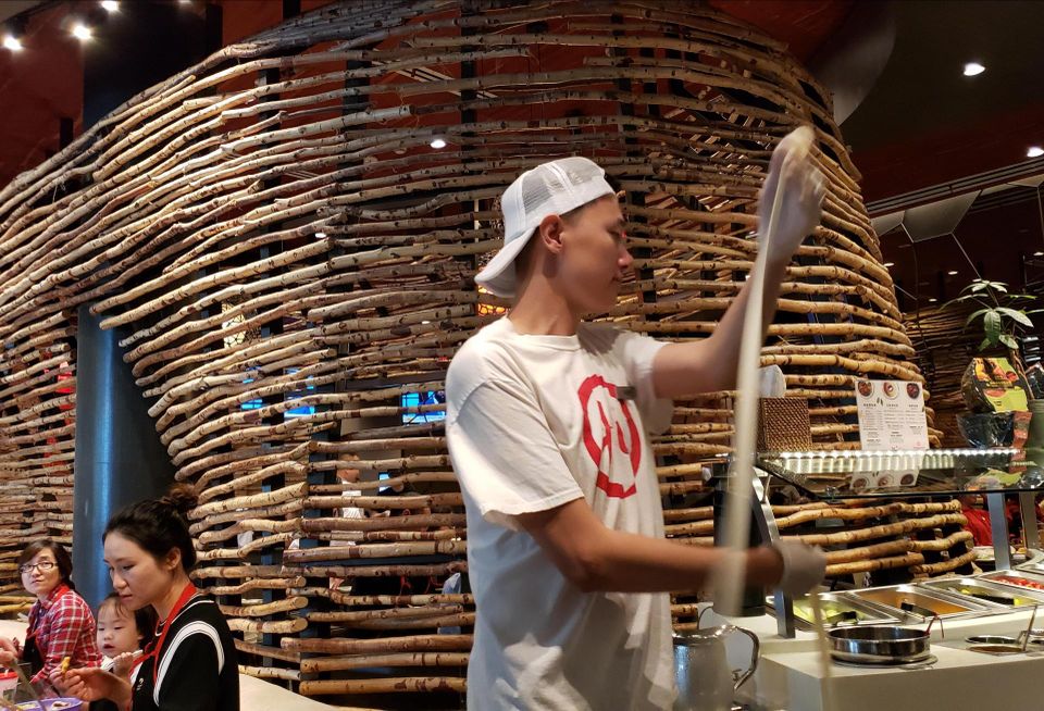 A noodle dancer performs at HiDiLao Hot Pot at the Westfield Santa Anita mall in Arcadia