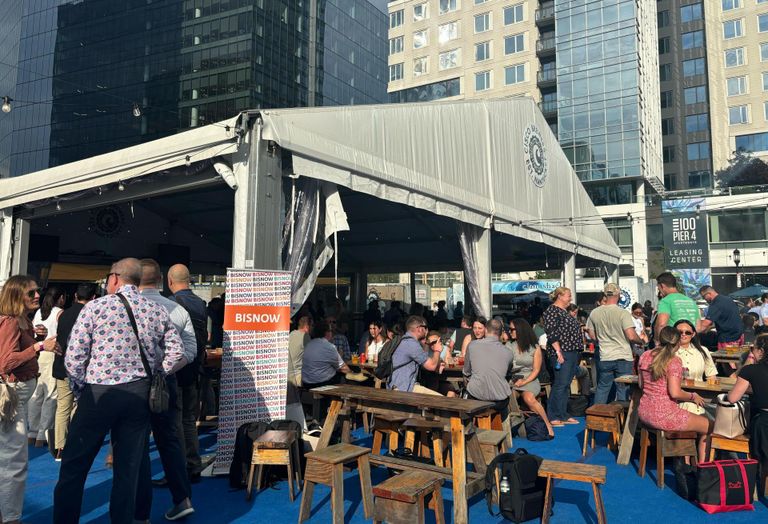 Attendees mingling at Bisnow's event at Cisco Brewers Seaport.