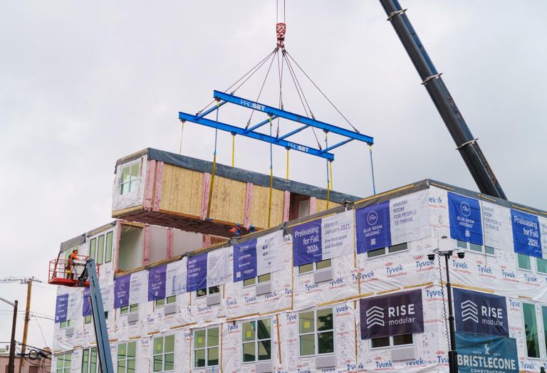Modular housing units were placed at 817 W. Eighth Ave. in Denver as part of the Blue Room House One development in late June 2026.