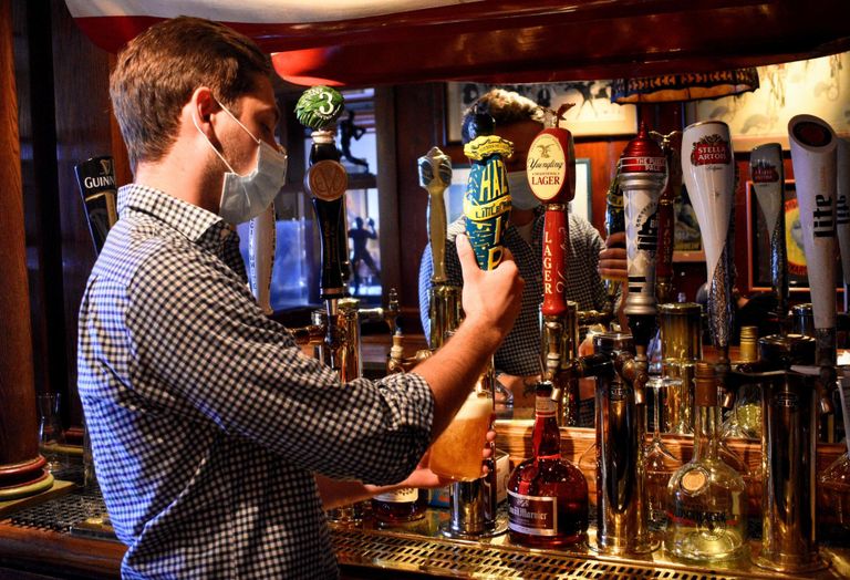 A bartender pours beer at Clyde's of Georgetown.