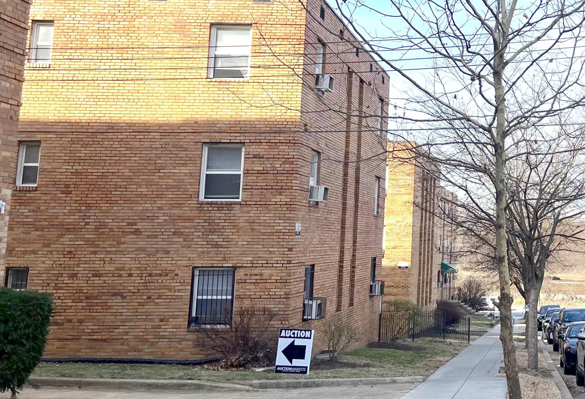 The auction was held in the community room at the 51-building Meadow Green Courts apartment complex. 
