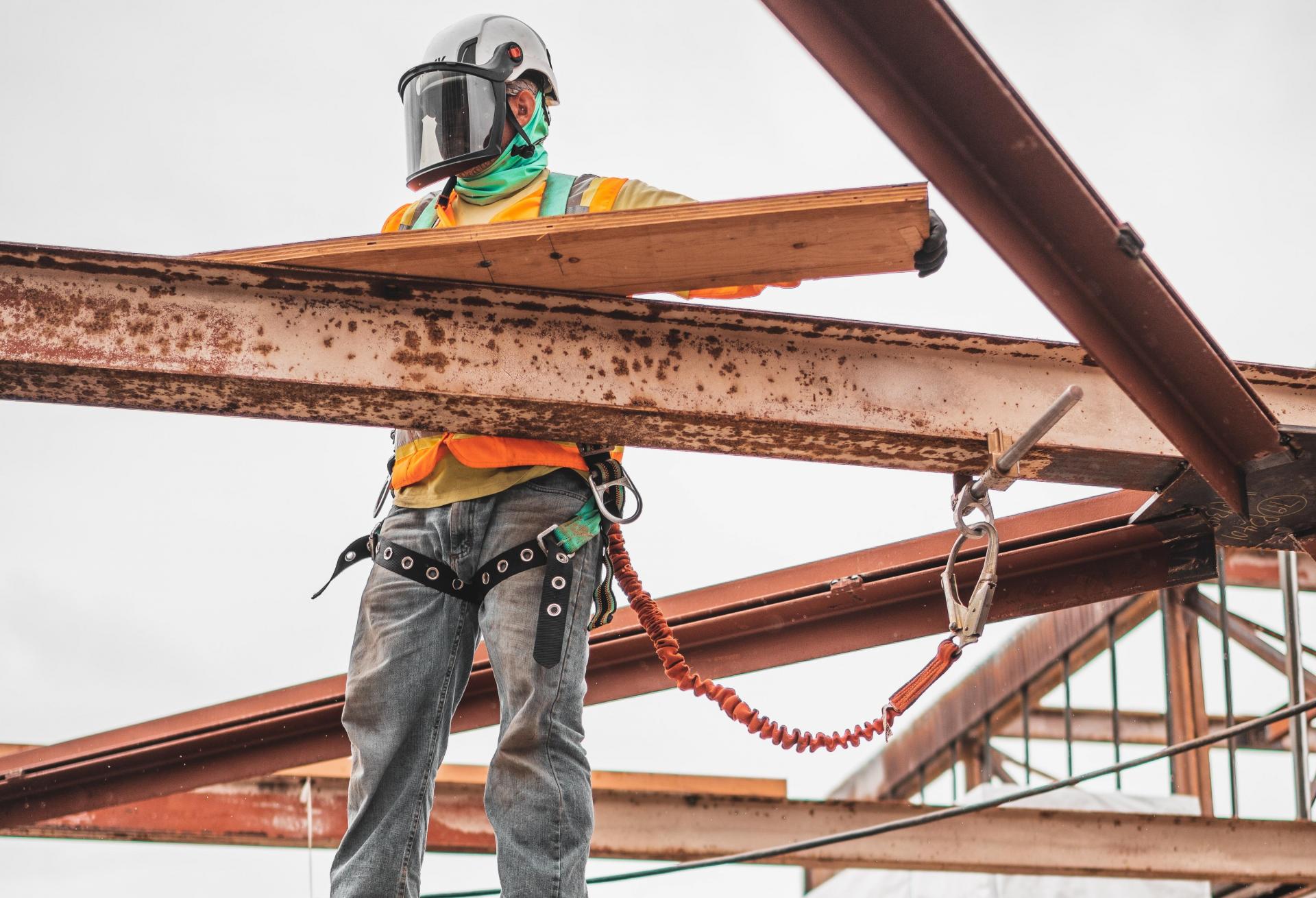 Man constructing building.