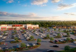 Rendering of an H-E-B supermarket and a strip of stores with a surface parking lot and trees behind