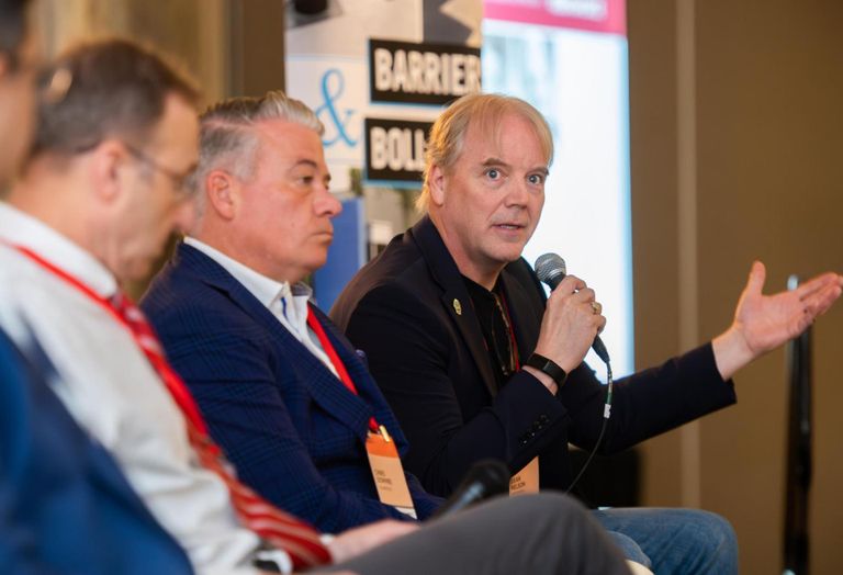 Cato's Dean Nelson, speaking at Bisnow's DICE East event in May. 
