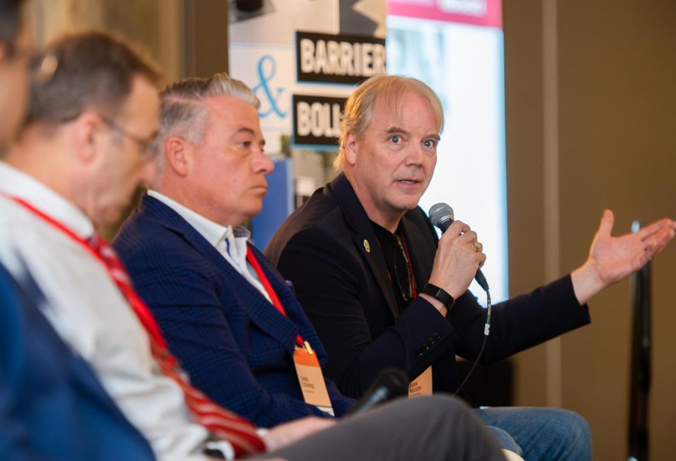 Cato's Dean Nelson, speaking at Bisnow's DICE East event in May.