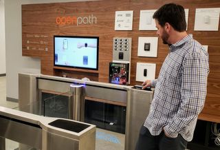 No more keycards. Openpath co-founder James Segil demonstrates how his phone allows him access through an automated entrance control gate. 
