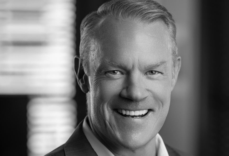 A professional black-and-white headshot of Formativ CEO Sean Campbell
