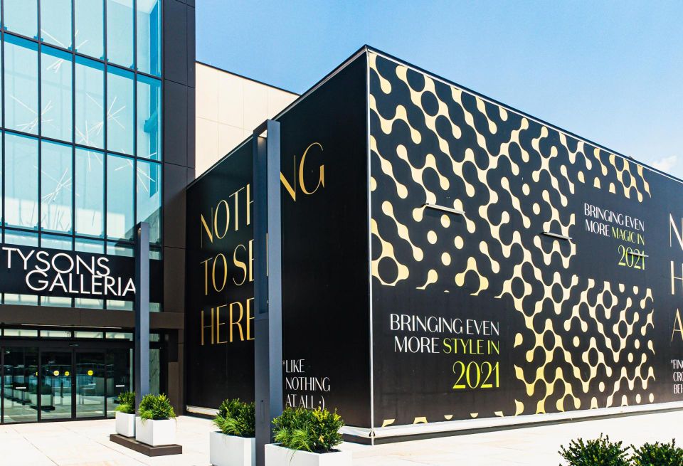 The entrance to the renovated former Macy's space at Tysons galleria, with wrapping still covering a portion of the exterior. 