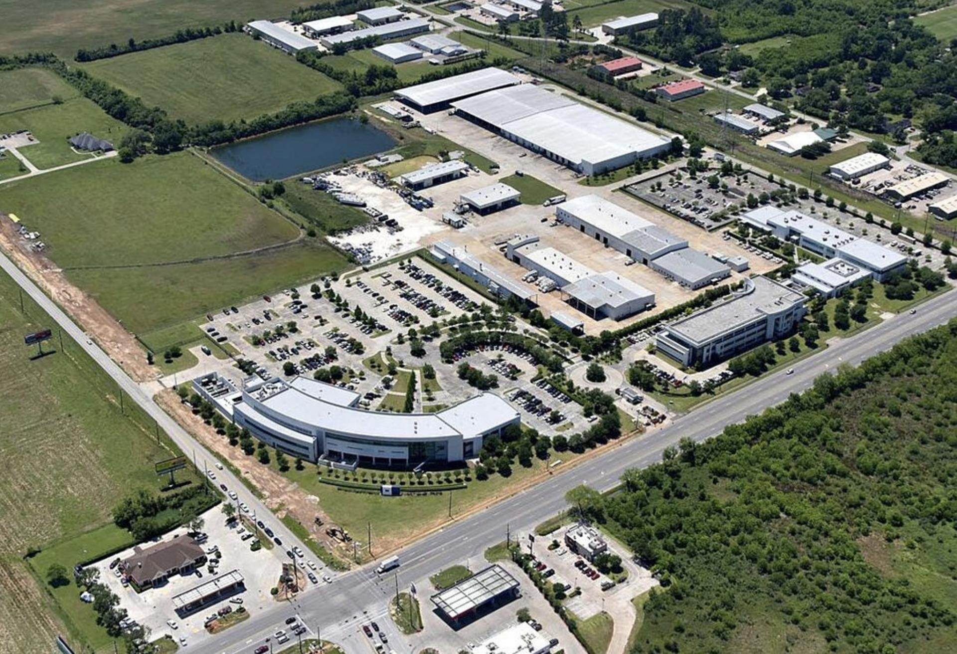 An aerial view of the former BJ Services Corporate Headquarters, a 571K SF office and industrial campus in Tomball, Houston.