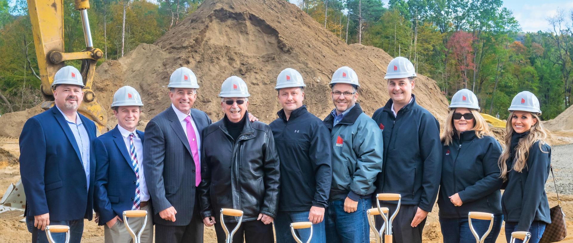 March Construction Owner and Founder Lou March (third from left) with March Construction team