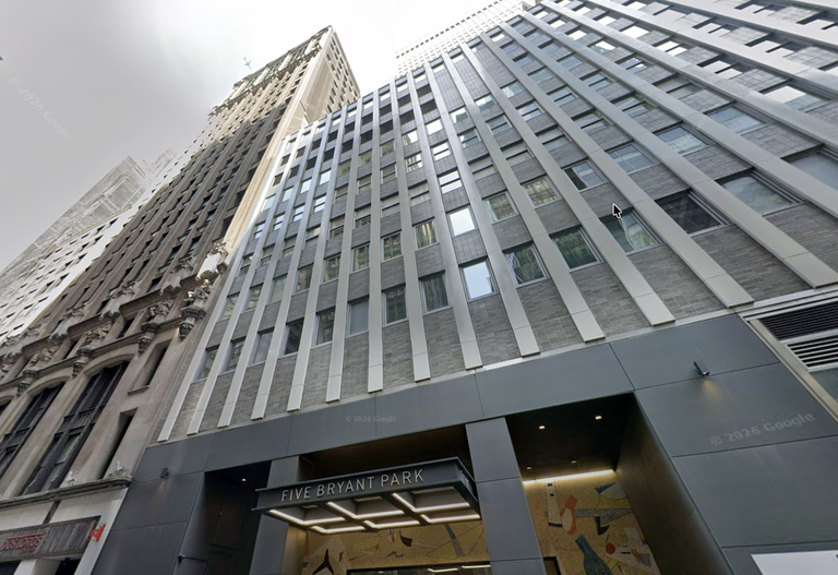 Tall modern building with a gray facade viewed from street level, featuring the entrance to "Five Bryant Park."