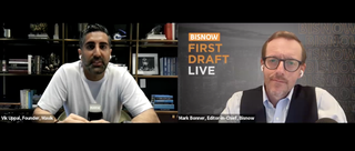Two men in a virtual conference, one with books behind him, the other in front of a "BISNOW First Draft Live" sign.