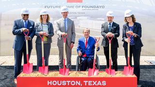 Six people in hard hats participating in a groundbreaking ceremony with shovels, standing in front of a sign reading "Future Home of Foundayo, Houston, Texas."