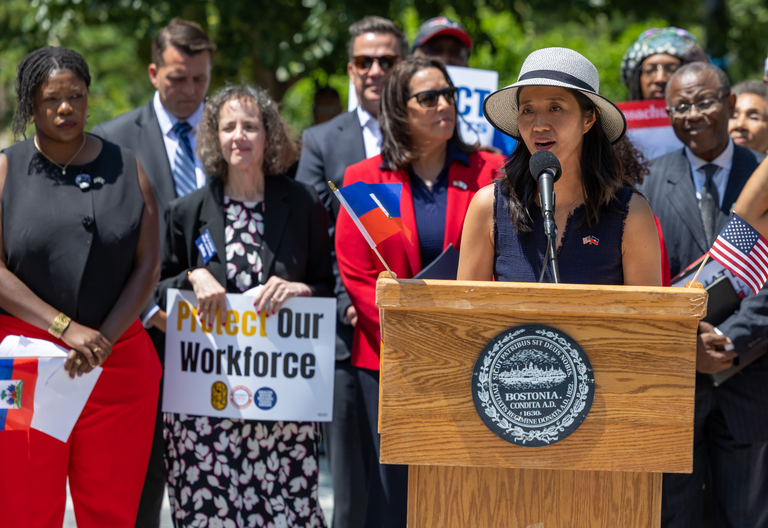 Boston Mayor Michelle Wu speaking at a rally about the Temporary Status Protection ruling.