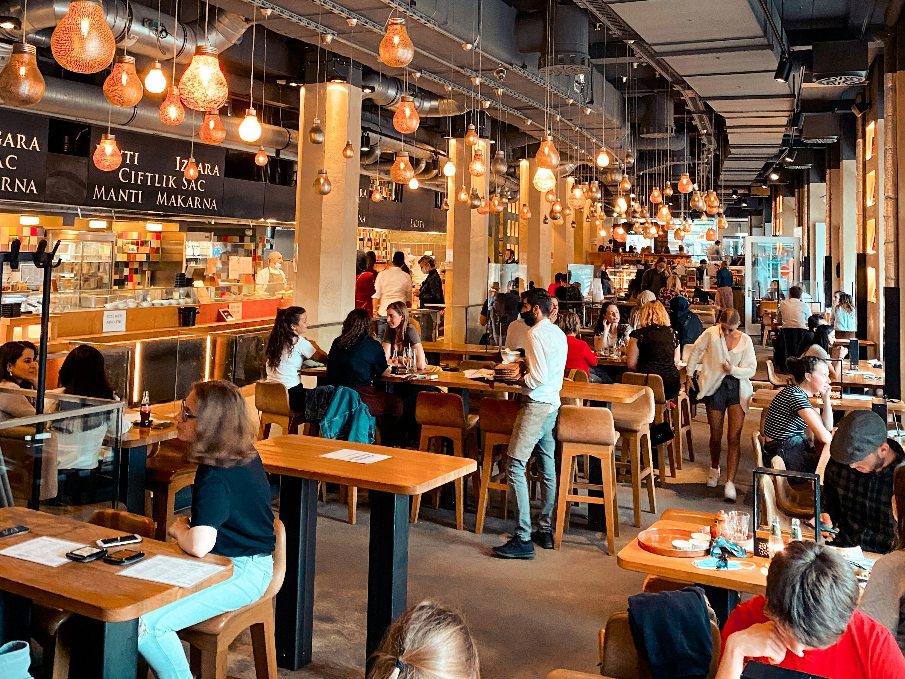 https://unsplash.com/photos/people-sitting-on-chair-in-restaurant-p85-MG66GRY