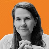 Portrait of a woman with long hair, wearing hoop earrings and a nose ring, against an orange background with subtle lines.