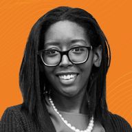 A woman with glasses and a pearl necklace smiles, set against an orange background with wavy lines.