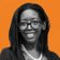 A woman with glasses and a pearl necklace smiles, set against an orange background with wavy lines.