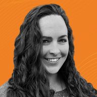 A woman with long curly hair smiles against an orange background with wavy lines.