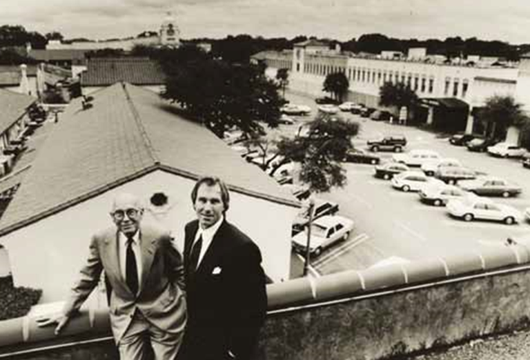 Two men on the roof of Highland Park Village.