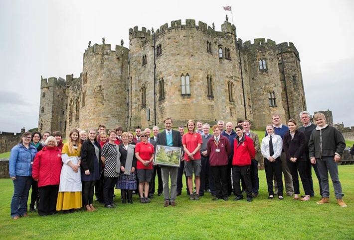 The Duke of Northumberland with various staff, to launch a Royal Mail stamp featuring Alnwick Castle, to mark Capability Brown’s 300th Birthday.

