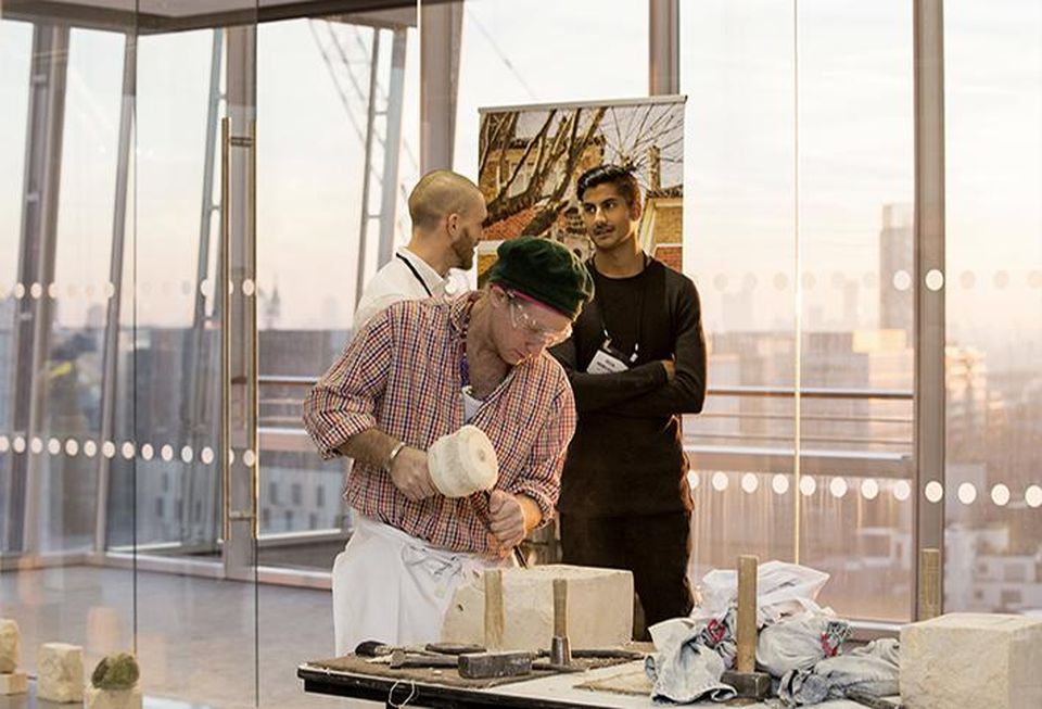 Sculptor Austin Emory shows attendees how he works at Bisnow's London New Frontiers 2017 event